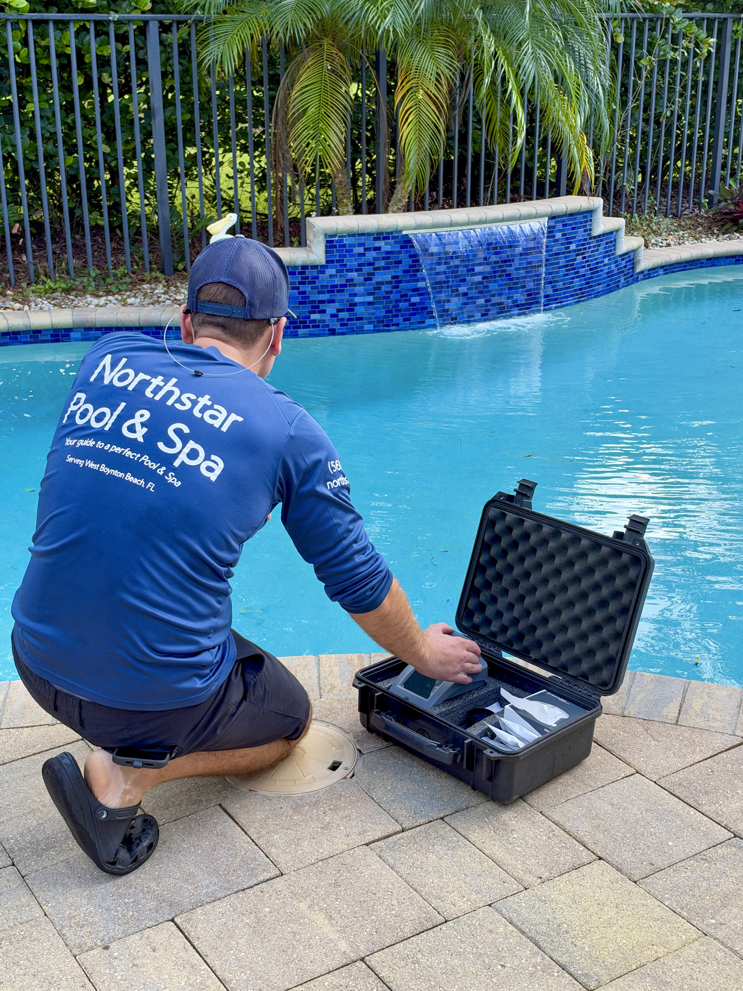 Northstar Pool & Spa technician performing professional water testing poolside in West Boynton Beach